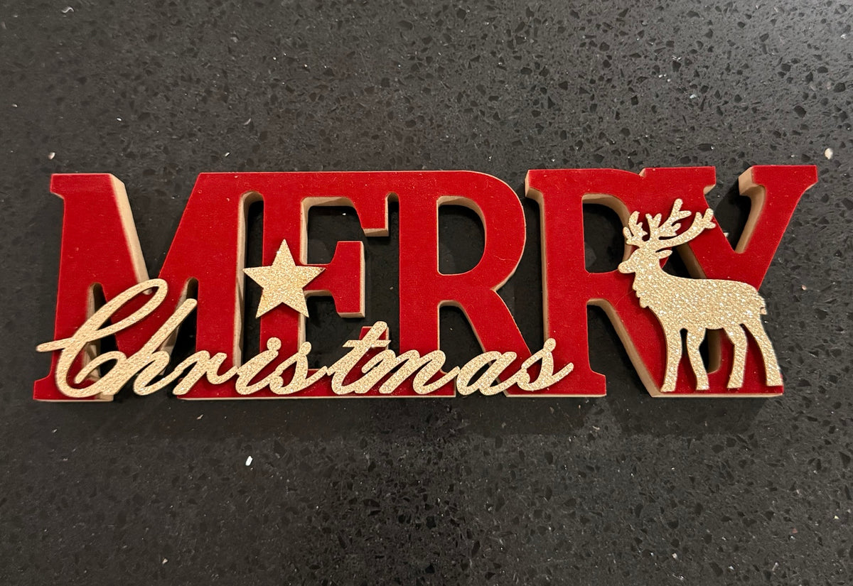Red and gold Merry Christmas wooden decoration with reindeer