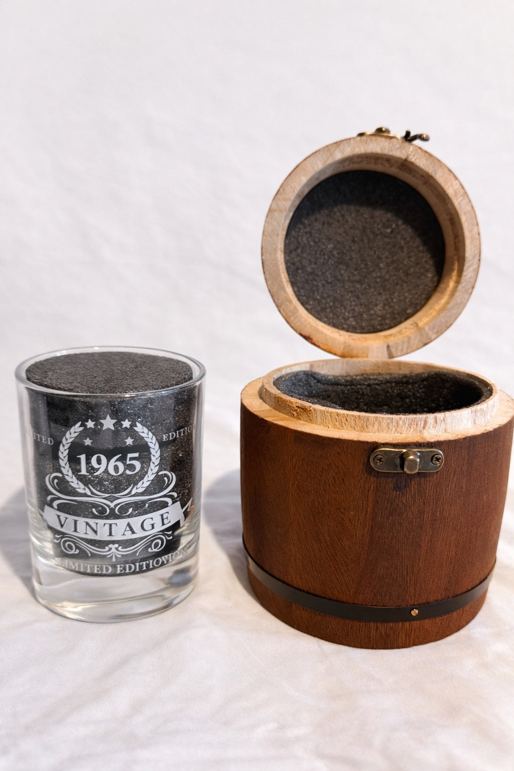 1965 vintage whisky glass beside open wooden presentation box