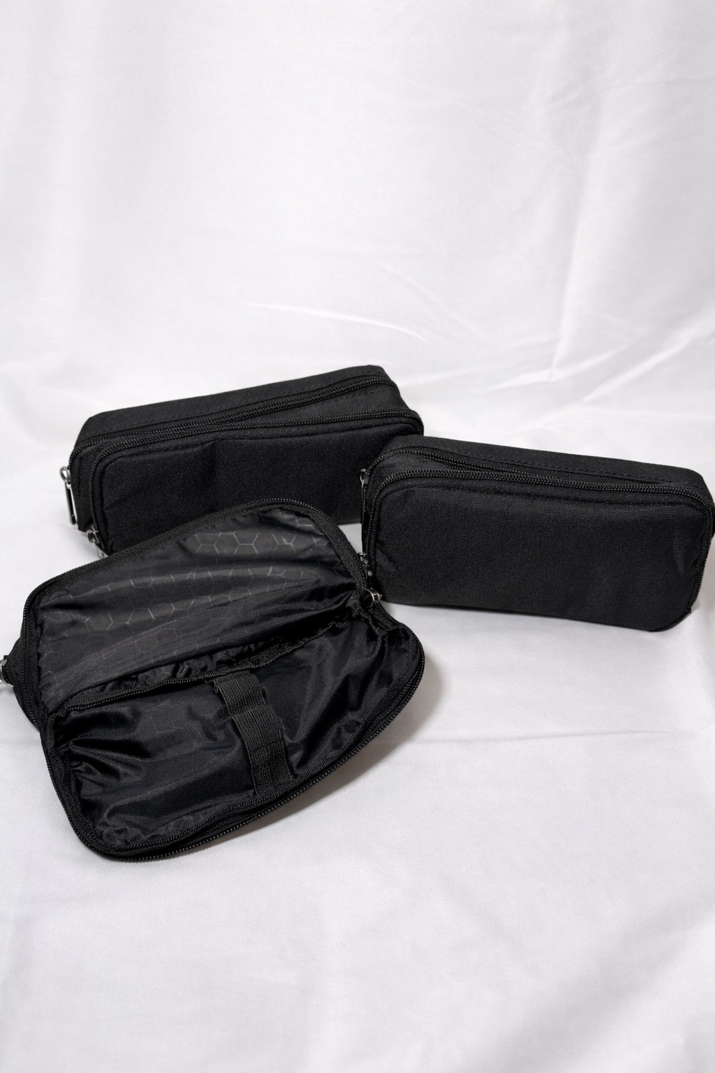 Black multi-compartment zip organiser cases