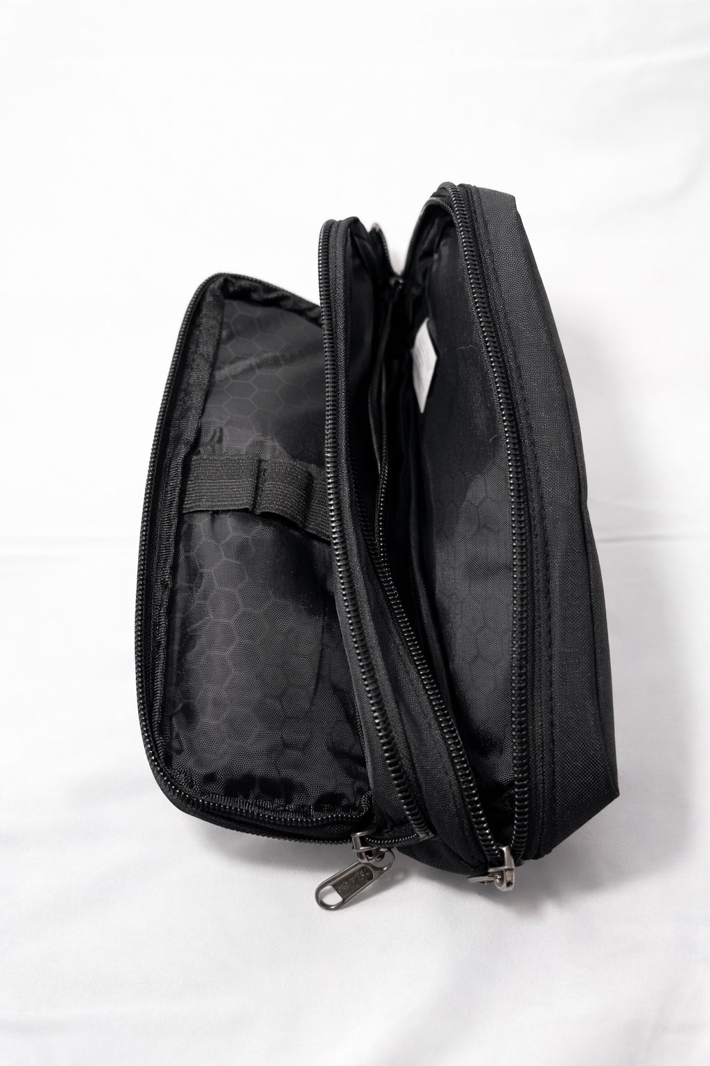 Black multi-compartment zip organiser side view