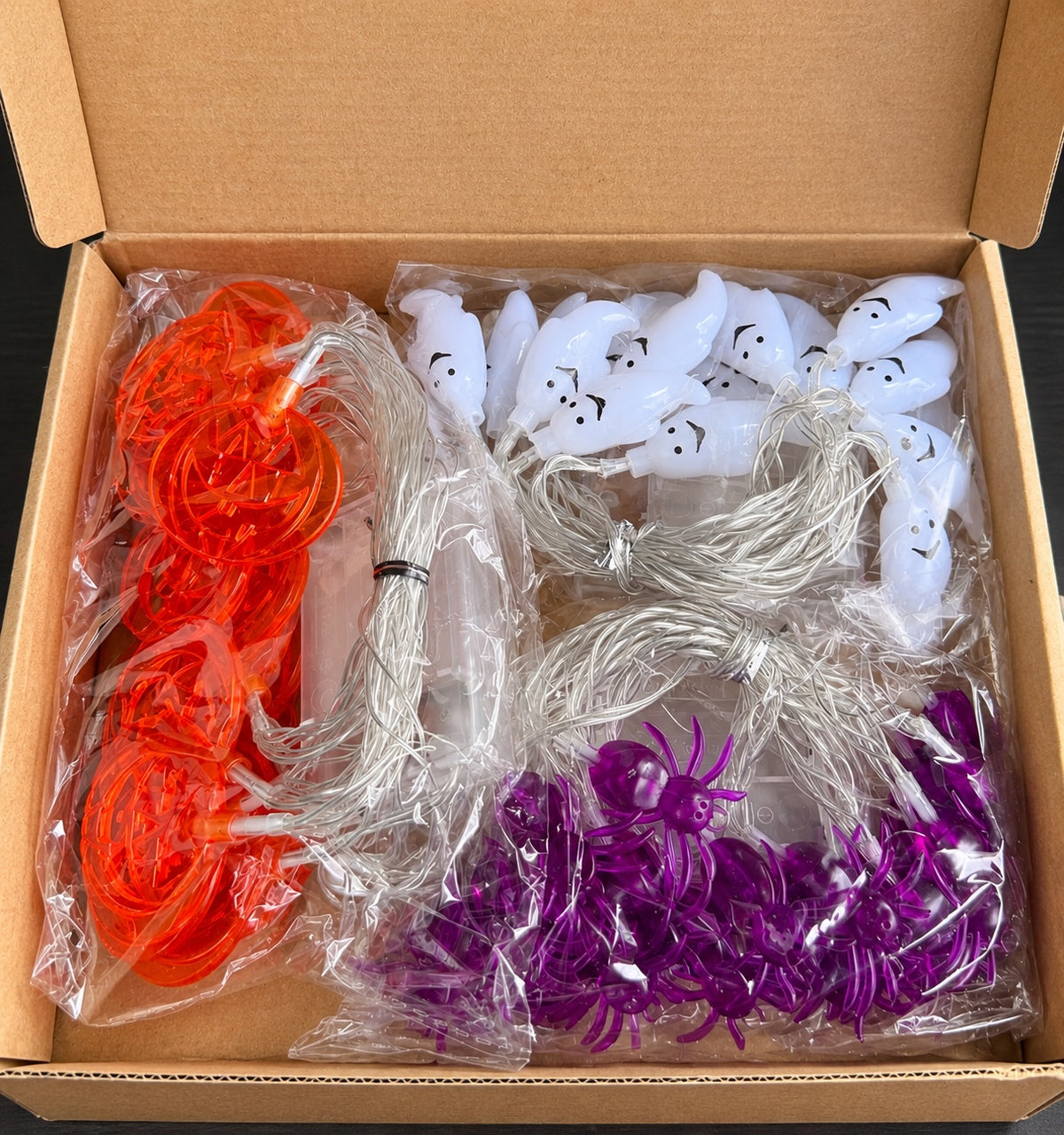 Halloween pumpkin ghost and spider string lights packaged in box