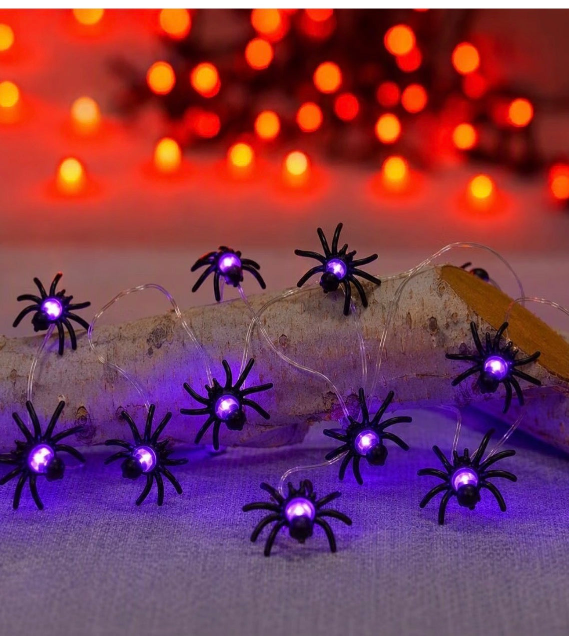 Purple spider Halloween string lights illuminated