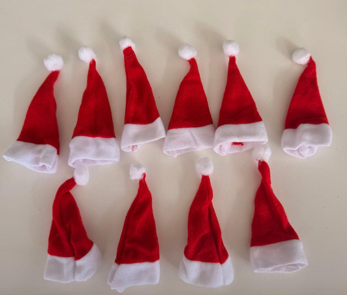 Pack of 10 mini red and white Santa hats